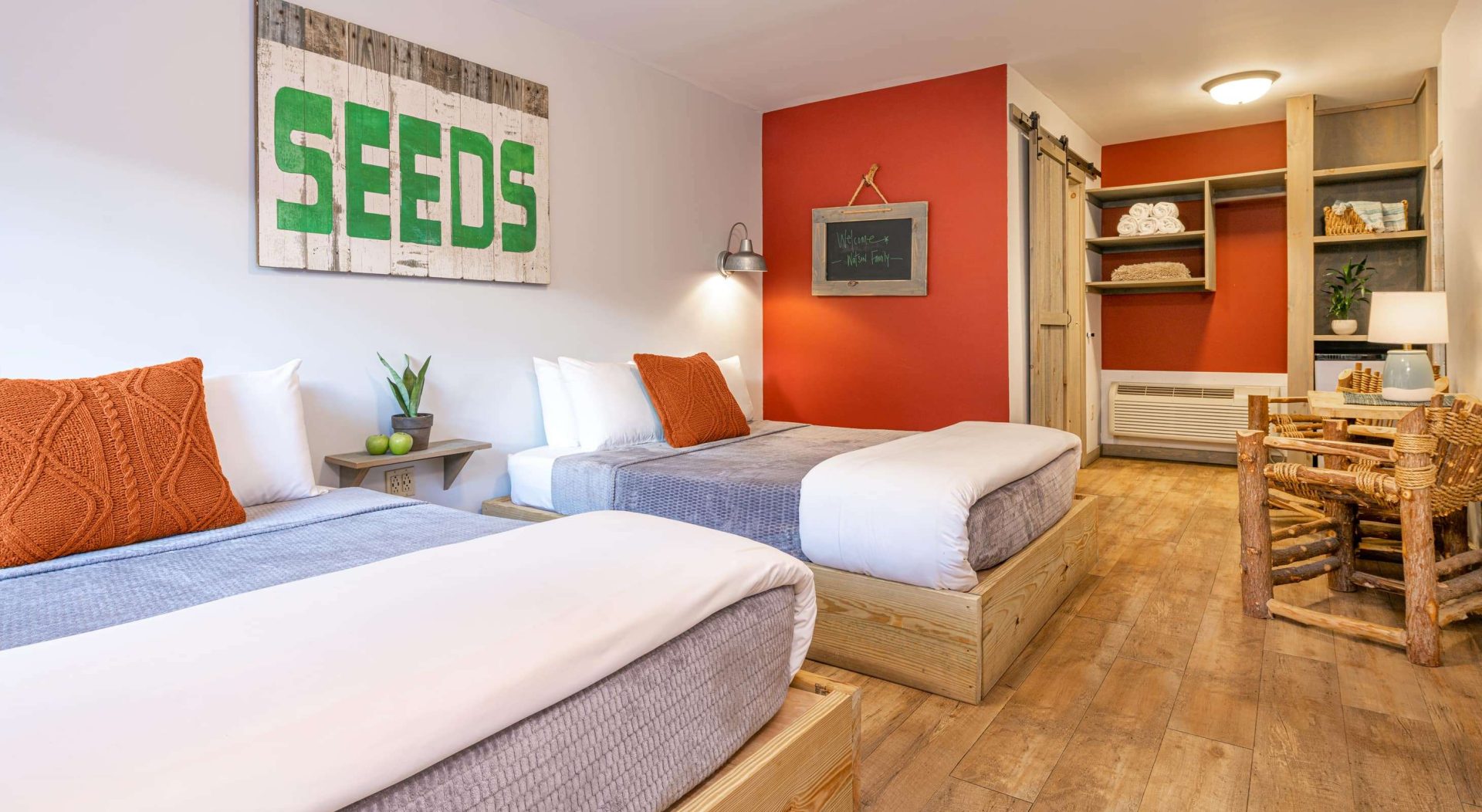 Two beds and a sitting area in a room at the Warren Lodge