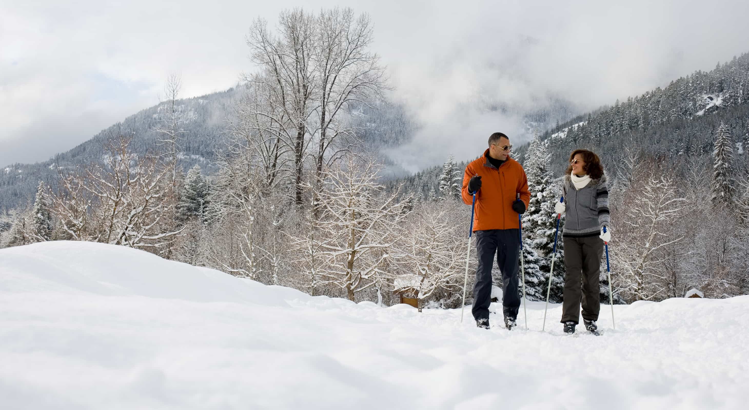 Couple cross country skiing at Vermont ski resort