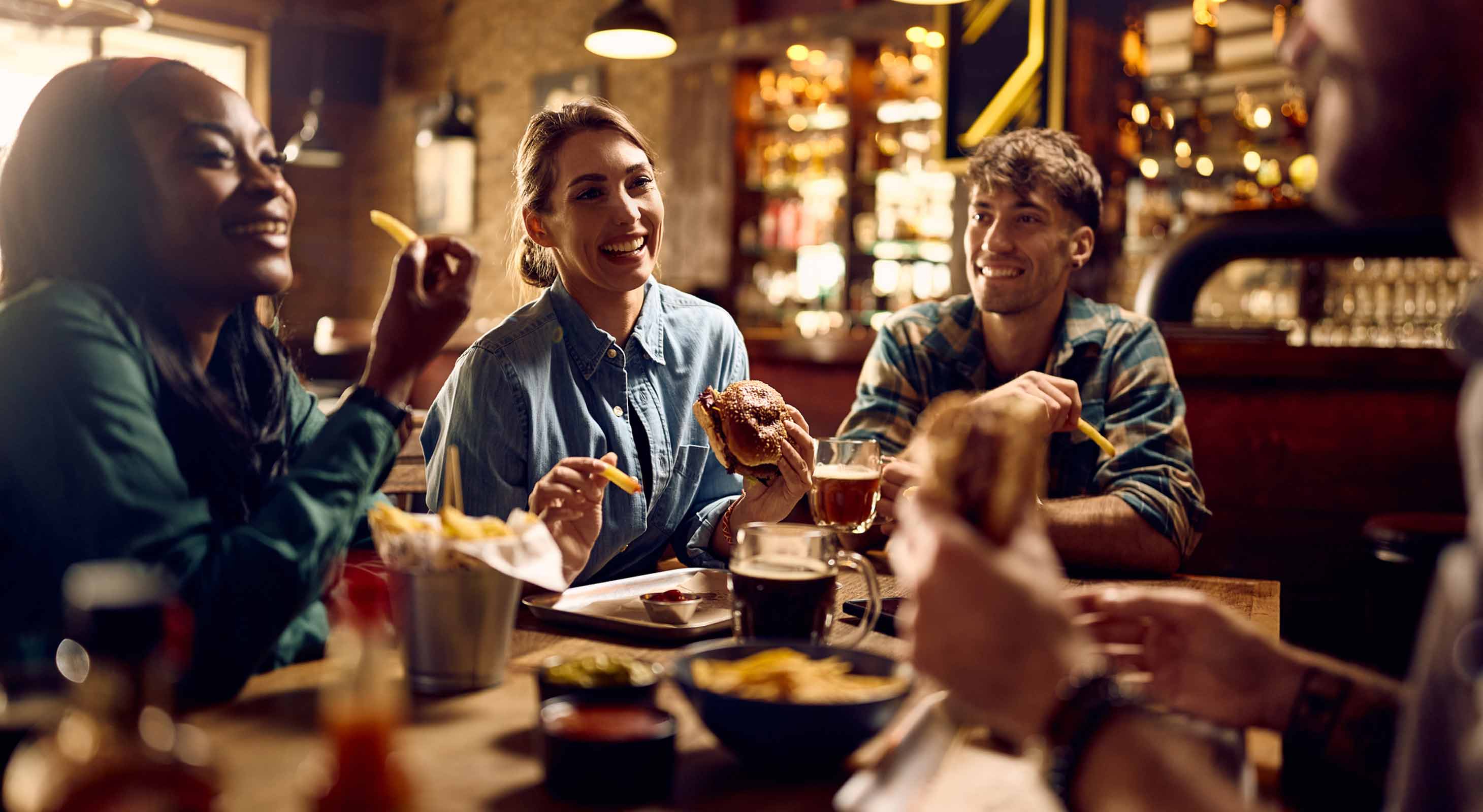 Friends enjoying food at Vermont restaurant