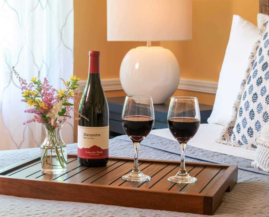 wine on a guest room bed
