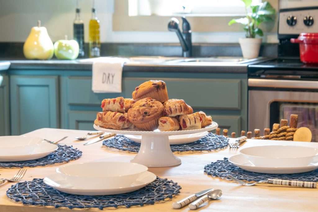 A plate of pastries on the table in a full kitchen at our Vermont lodge