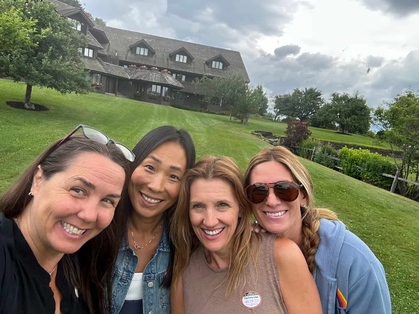 A group of friends taking a Highland cow tour at the von Trapp Family Farm