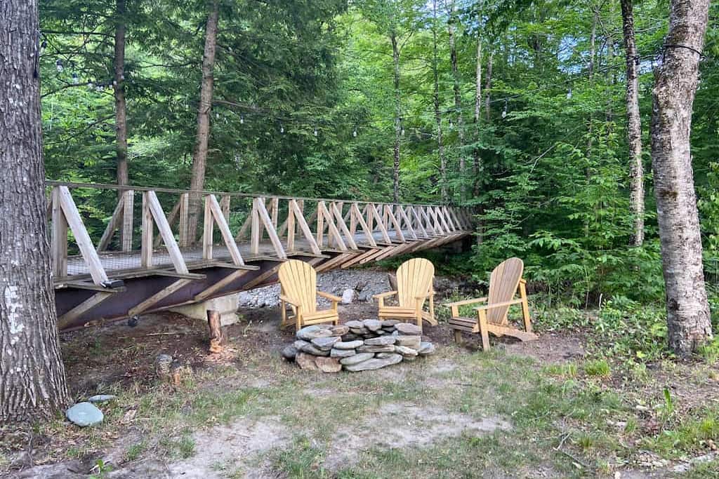 Outdoor firepit next to the Mad River at our Vermont lodging