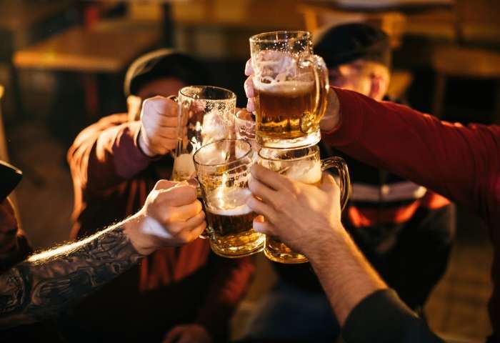 Friends cheers at Siptemberfest at Mad River Glen
